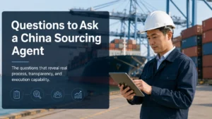 Man in a white safety helmet using a tablet at a shipping port with cranes, cargo containers, and a cargo ship in the background. Text overlay reads 'Questions to Ask a China Sourcing Agent'.